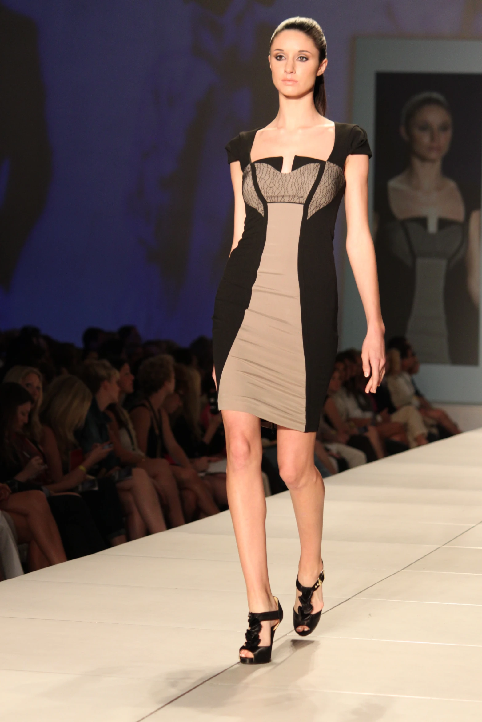 a fashion show of a female with one leg off the ground