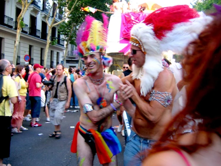 people standing around wearing costumed clothing and masks