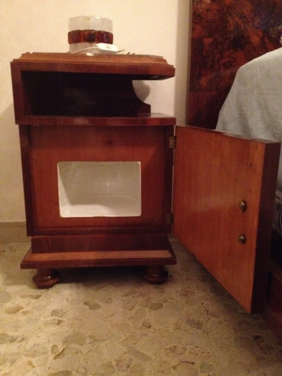 a bed with a wooden chest next to it