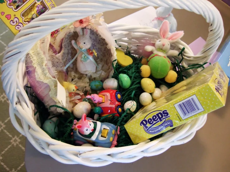 a basket filled with lots of toy animals