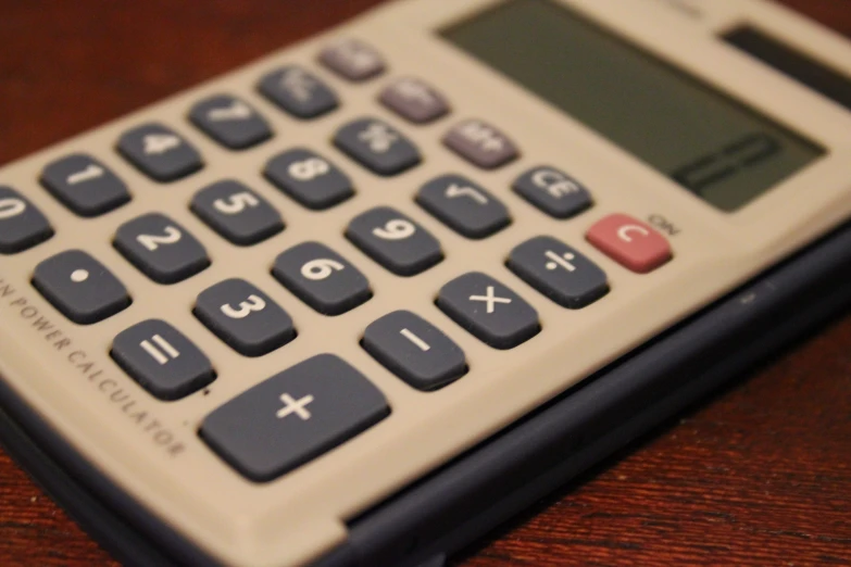 an image of a calculator on a desk