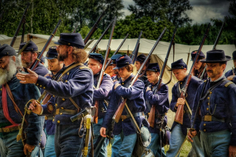 some men in civil war uniforms with arms extended