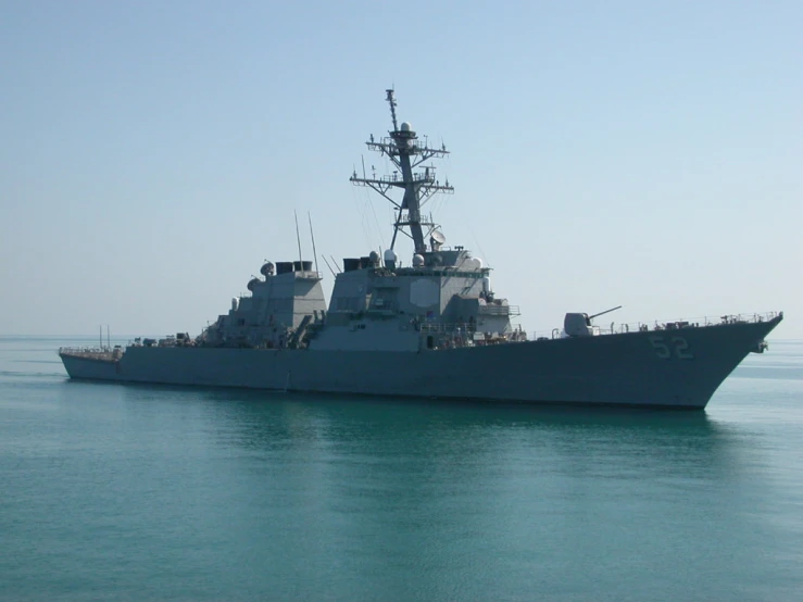 an aircraft carrier floating on the ocean