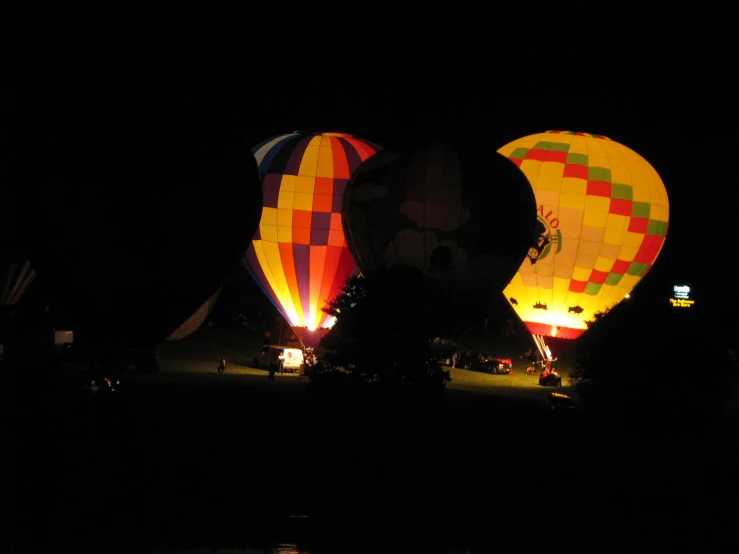 the brightly lit  air balloons have turned on