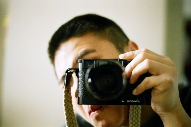 a man taking a picture of himself in front of the camera