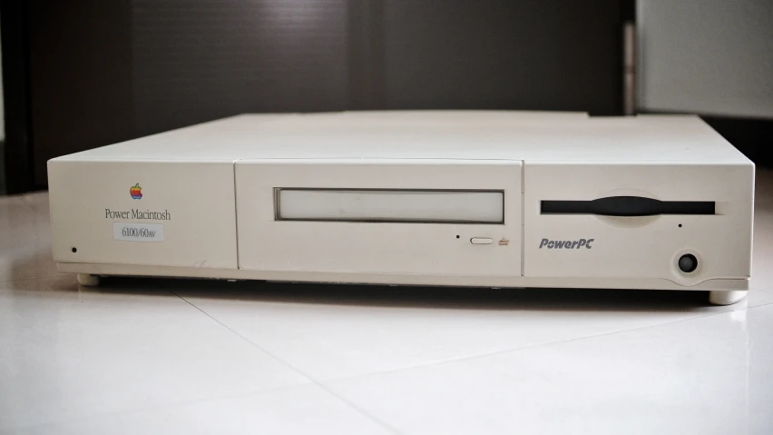 a white computer with the top off on a table