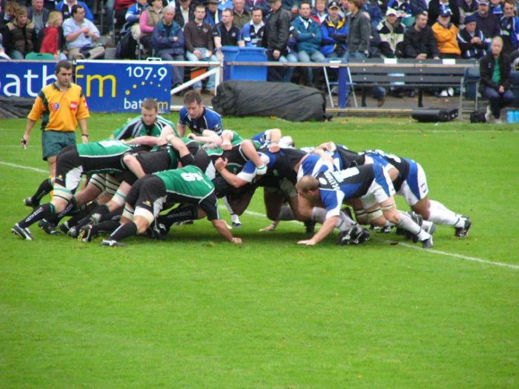 there are men that are fighting for the football ball