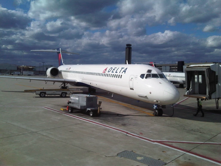 a plane on a runway waiting for passengers to board