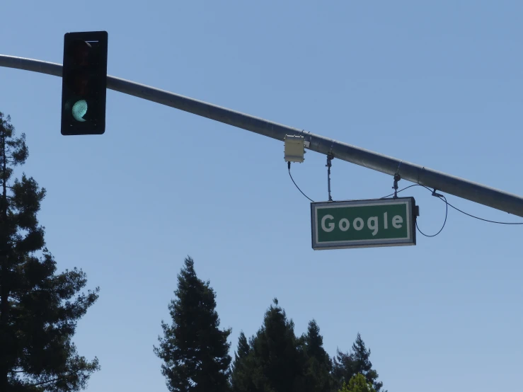 a street sign next to a traffic light