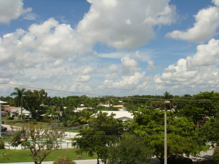 a neighborhood and park with some trees on one side