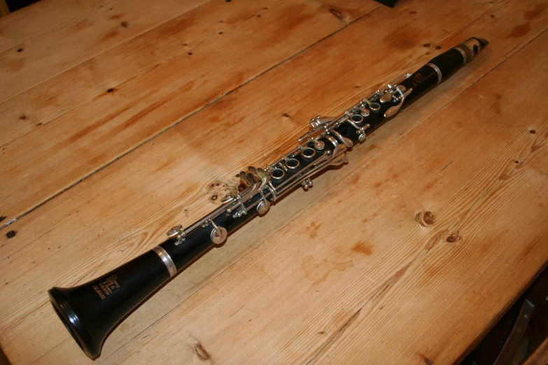 a recorder that is sitting on a wooden surface