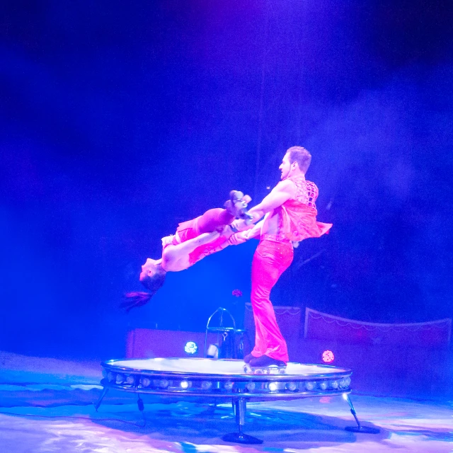 a couple of dancers doing tricks on stage