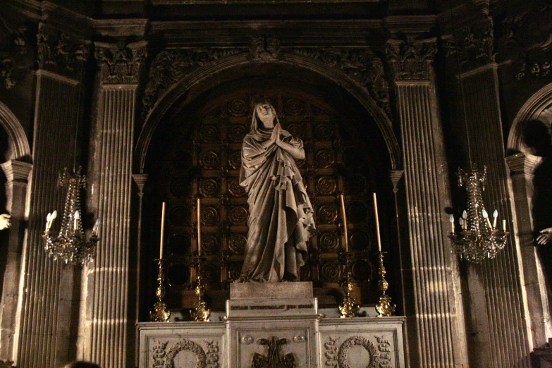 an altar with a large statue in it