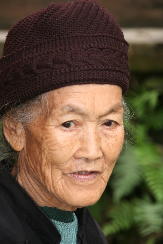 a close up of a person wearing a knit hat