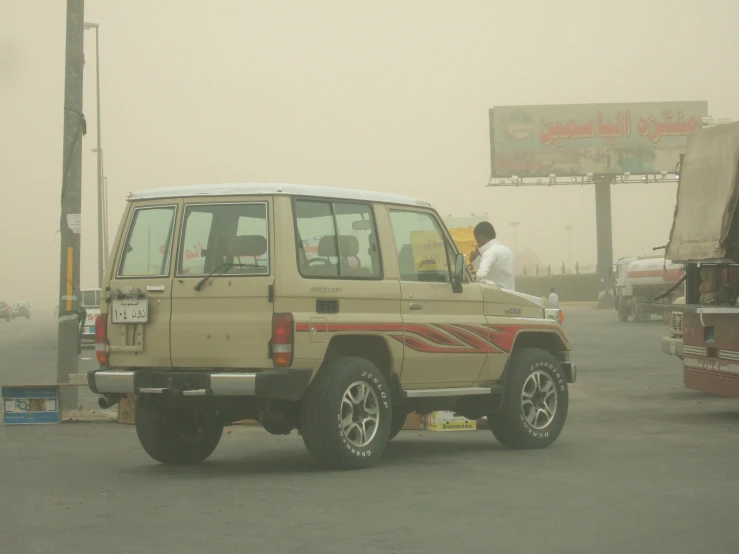 a man sits in the passenger side of a car