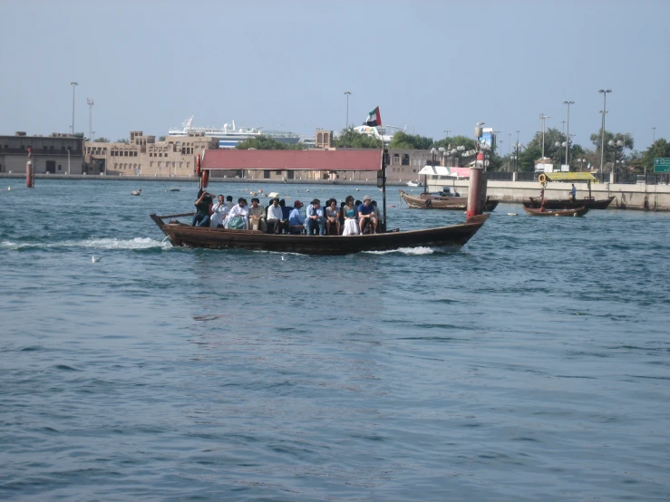 a group of people riding on top of a boat