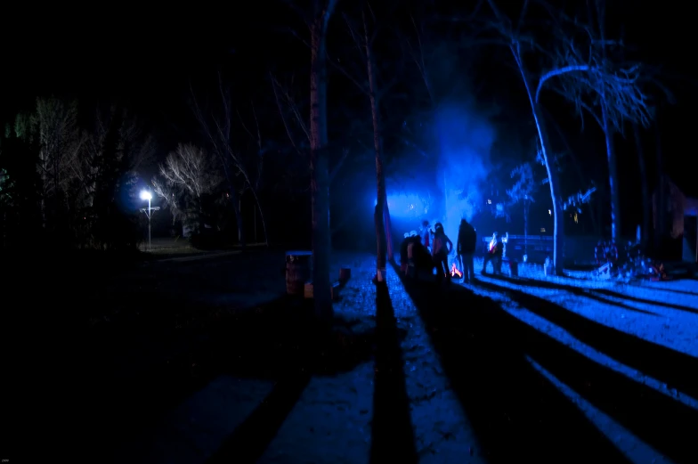 a train track with the tracks illuminated by lights