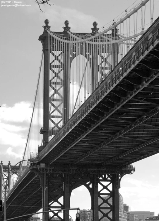 view of the brooklyn bridge and a couple of benches underneath