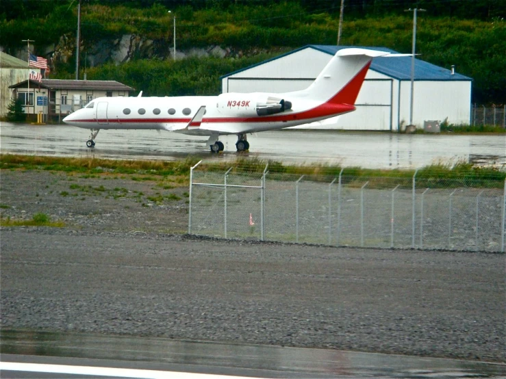 a large propeller plane parked in an airport
