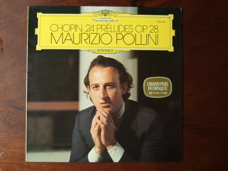 a po of markio pollini on a wood surface