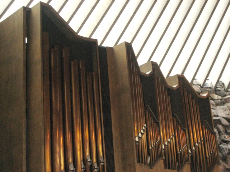 a pipe on the wall inside of a church