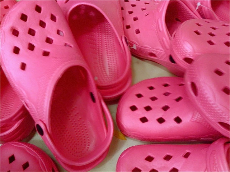 a bunch of pink shoes in the middle of them