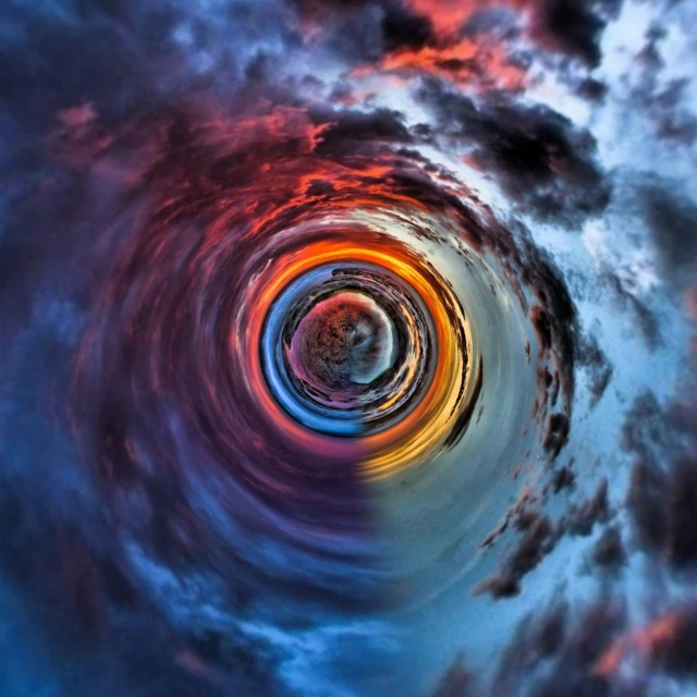 the center of a vortex in the sky with clouds