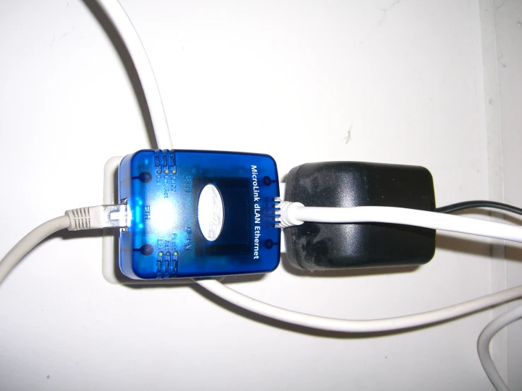 a computer power strip attached to the back of a cell phone