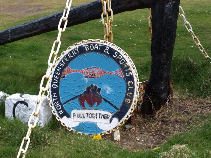 a sign for the fulsberg football team hanging from a chain