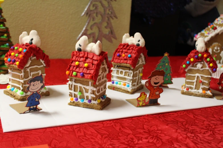 the table has small buildings that look like gingerbread houses