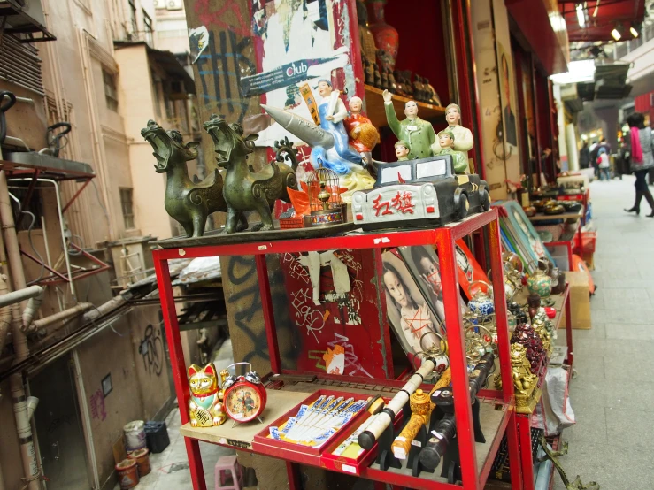 the shop front of a small asian store is very cluttered