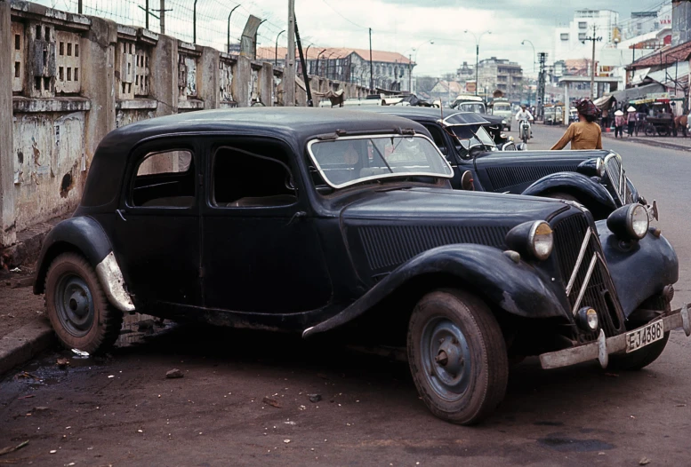 old black cars on a street in africa