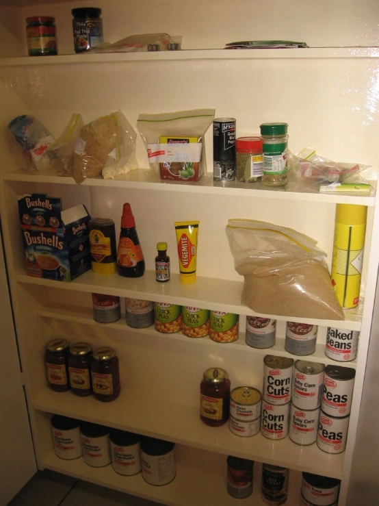 an open refrigerator door is filled with food