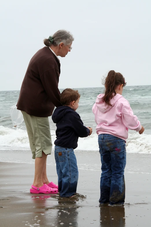 there are three children playing with their grandmother