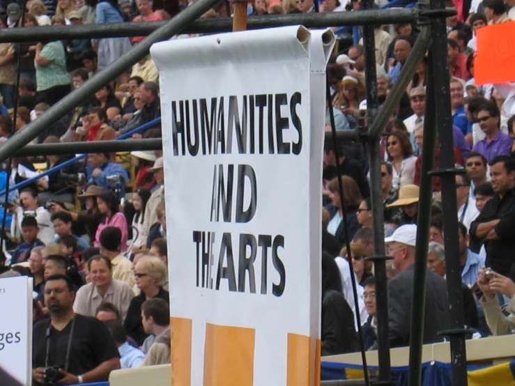 a sign with writing stating downtonities and sad that arts