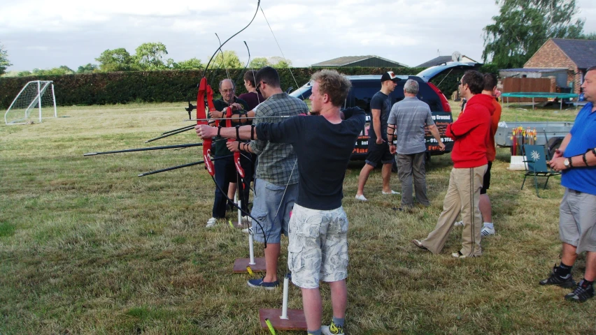 some people in a field getting ready to compete