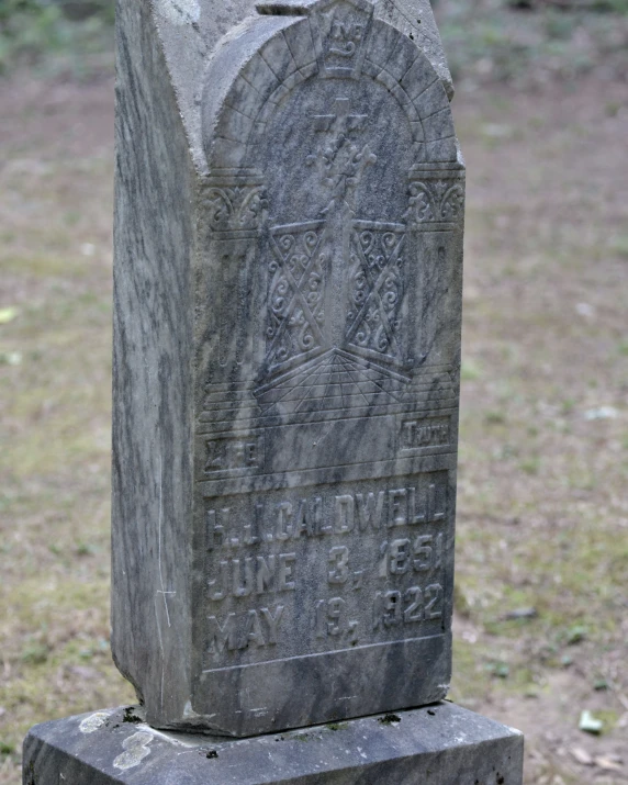 the tombstone on which a man has been buried