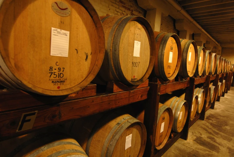 a room filled with lots of barrels filled with wine