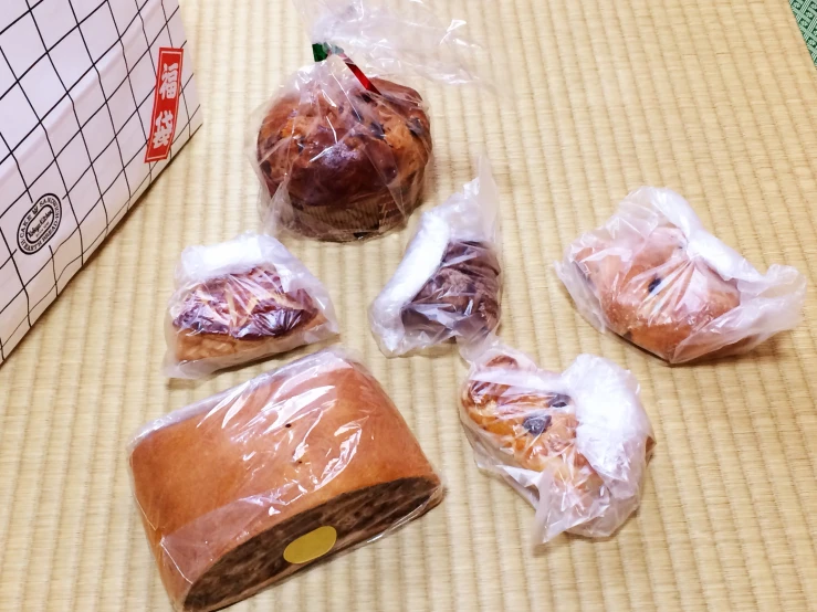 four wrapped cookies and some lollipops in plastic bags