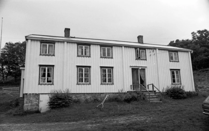 black and white pograph of a two story home