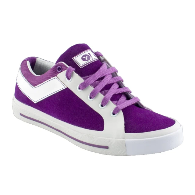 a purple and white tennis shoe on top of a white platform