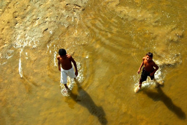 two people are surfing in the water together