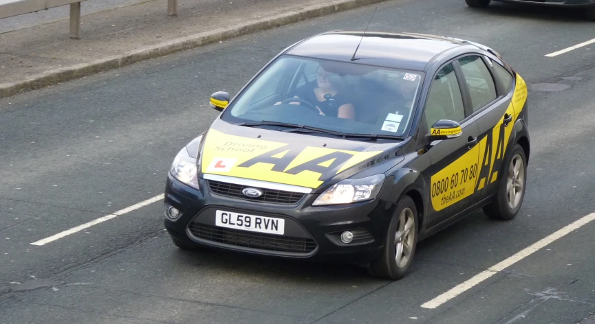 a black car with yellow writing on it