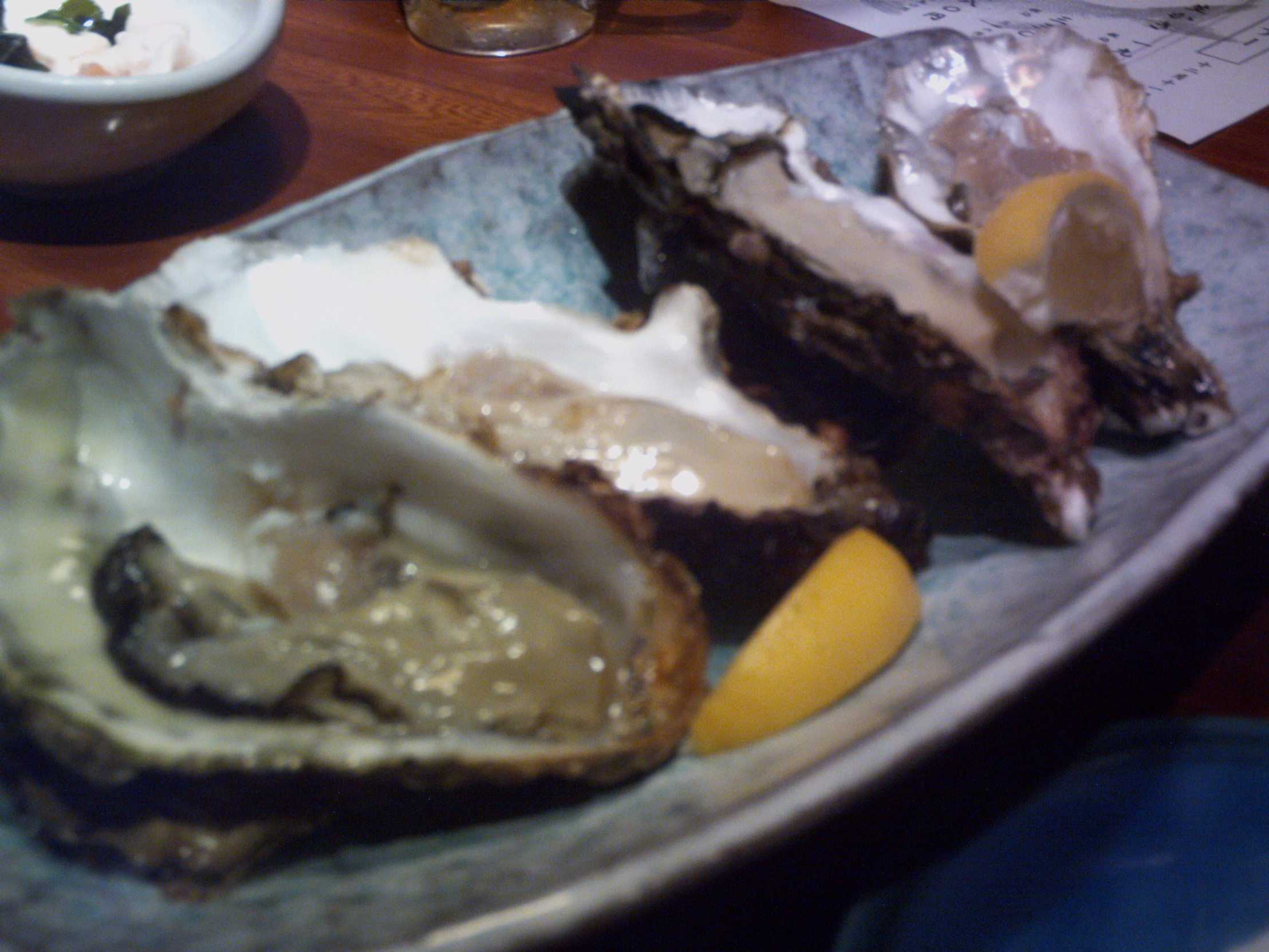 a plate filled with oysters and other items