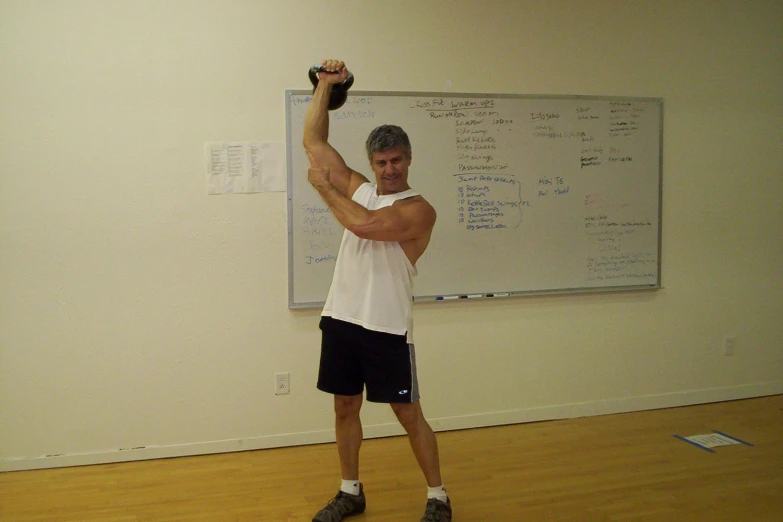 an image of a man holding a large object