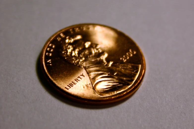 the gold coin shows a head of an eagle