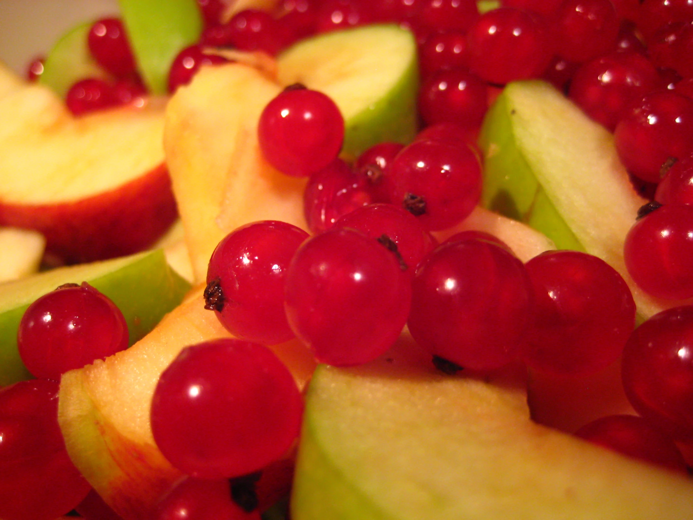 closeup of sliced red apple and some other fruit