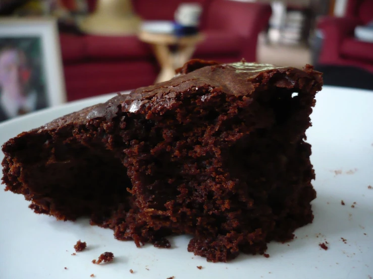 a piece of chocolate cake on a white plate