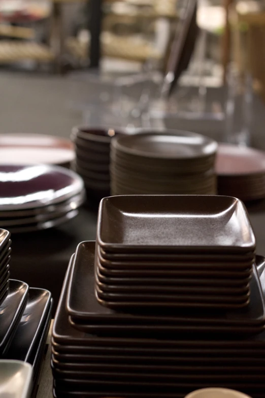 a group of empty plates sitting on top of a table