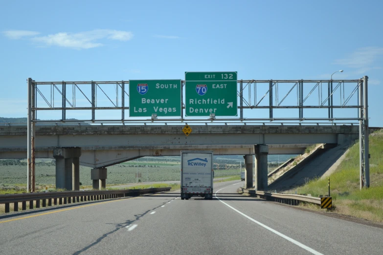a highway with two interstate signs above it